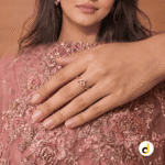 Double heart gold ring for women with intertwined design and sparkling stone accents