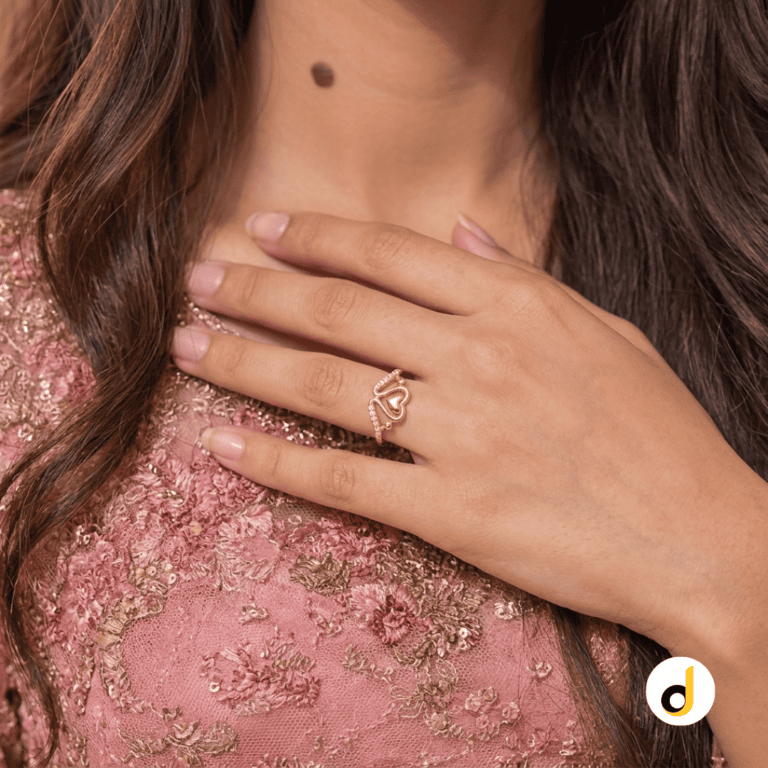 Crown heart gold ring for women with a V-shaped chevron band and stone accents