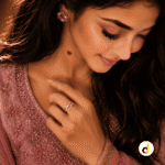 Gold-tone intertwined crossover ring with a sparkling crystal accent band