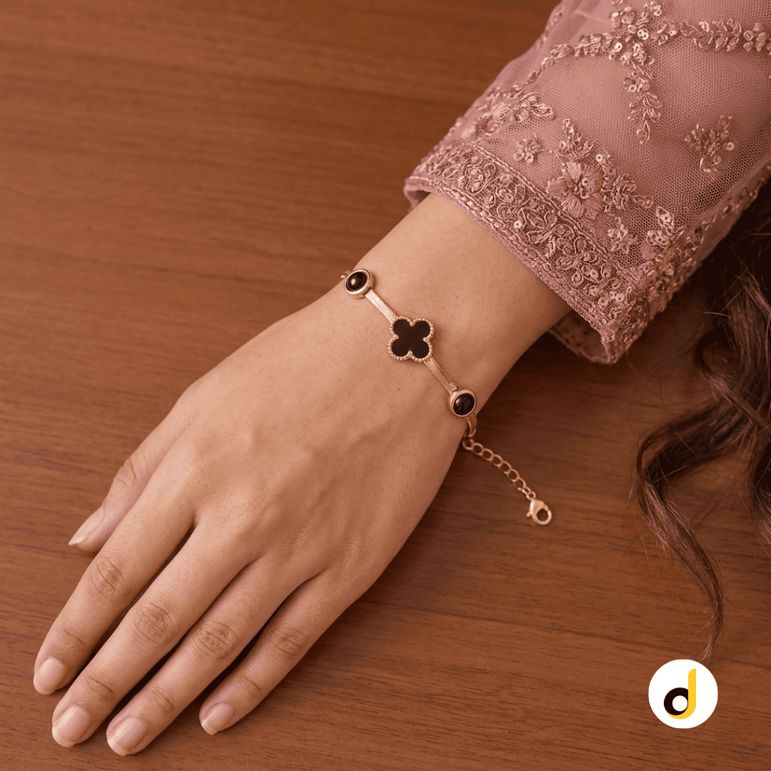 Black enamel clover bracelet for women and girls with gold plated finish Black enamel clover bracelet for women and girls with gold plated finish